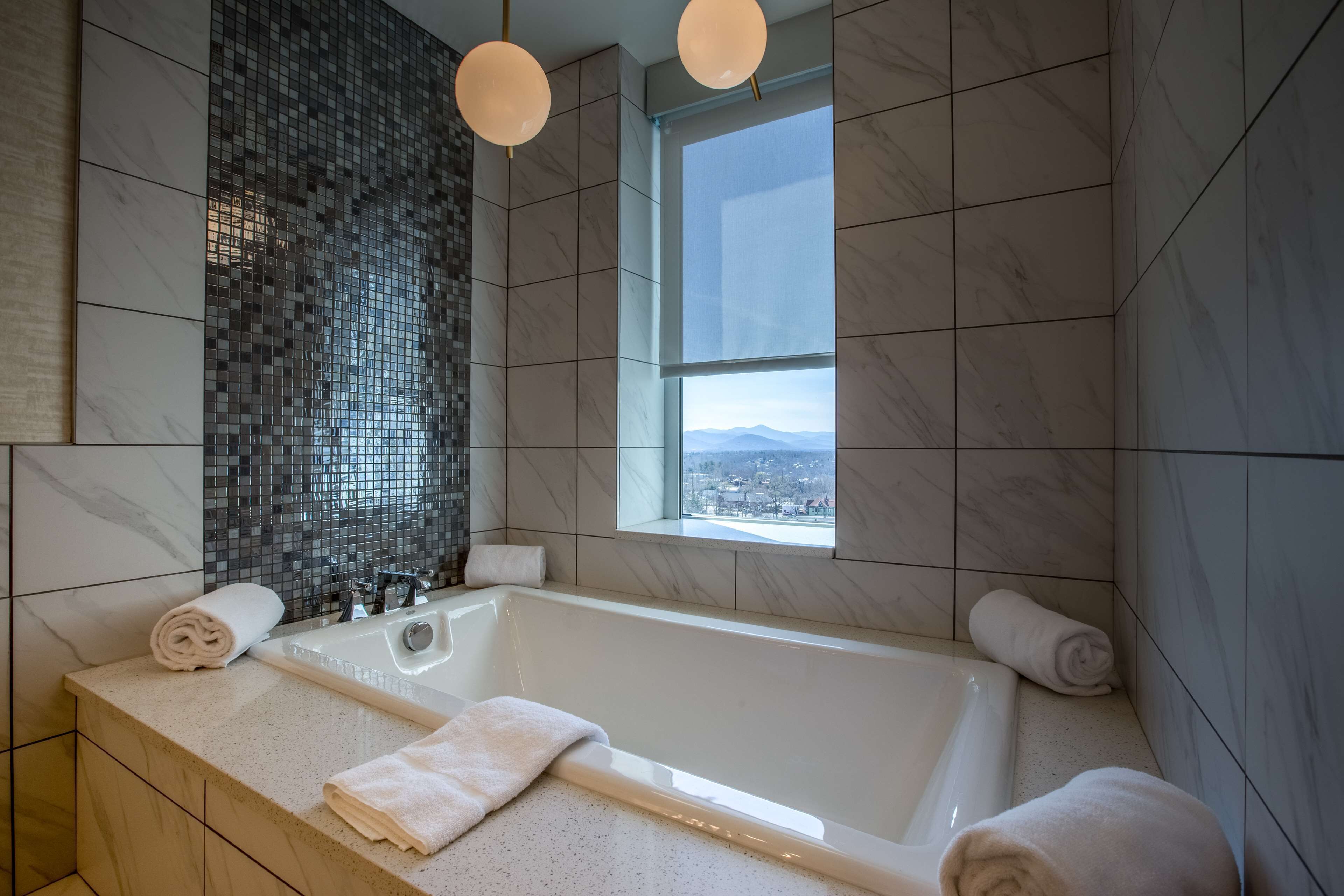 designer toiletries, hair dryer, towels