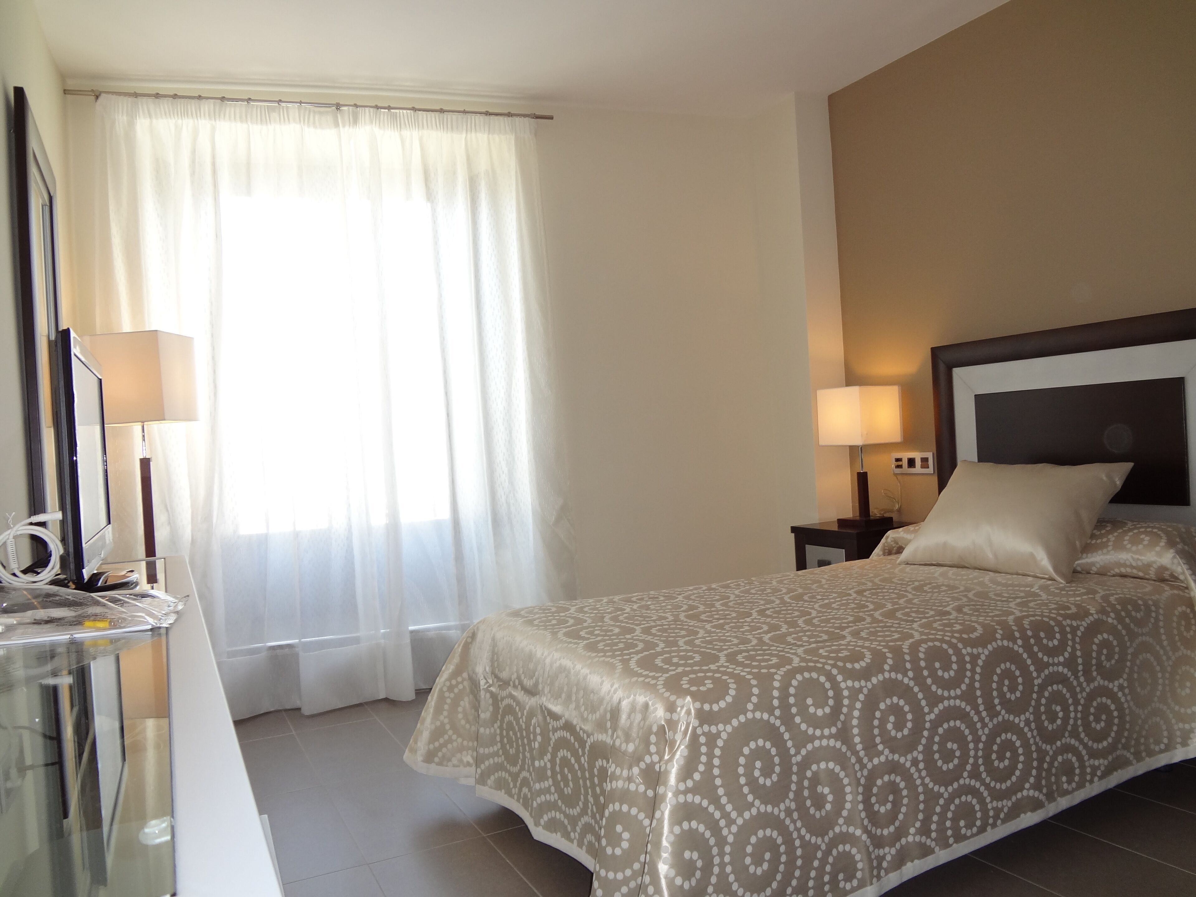 Desk, laptop workspace, blackout curtains, free WiFi