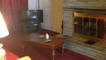 Apartment, 2 Double Beds (Ground Floor) | Living area | Flat-screen TV