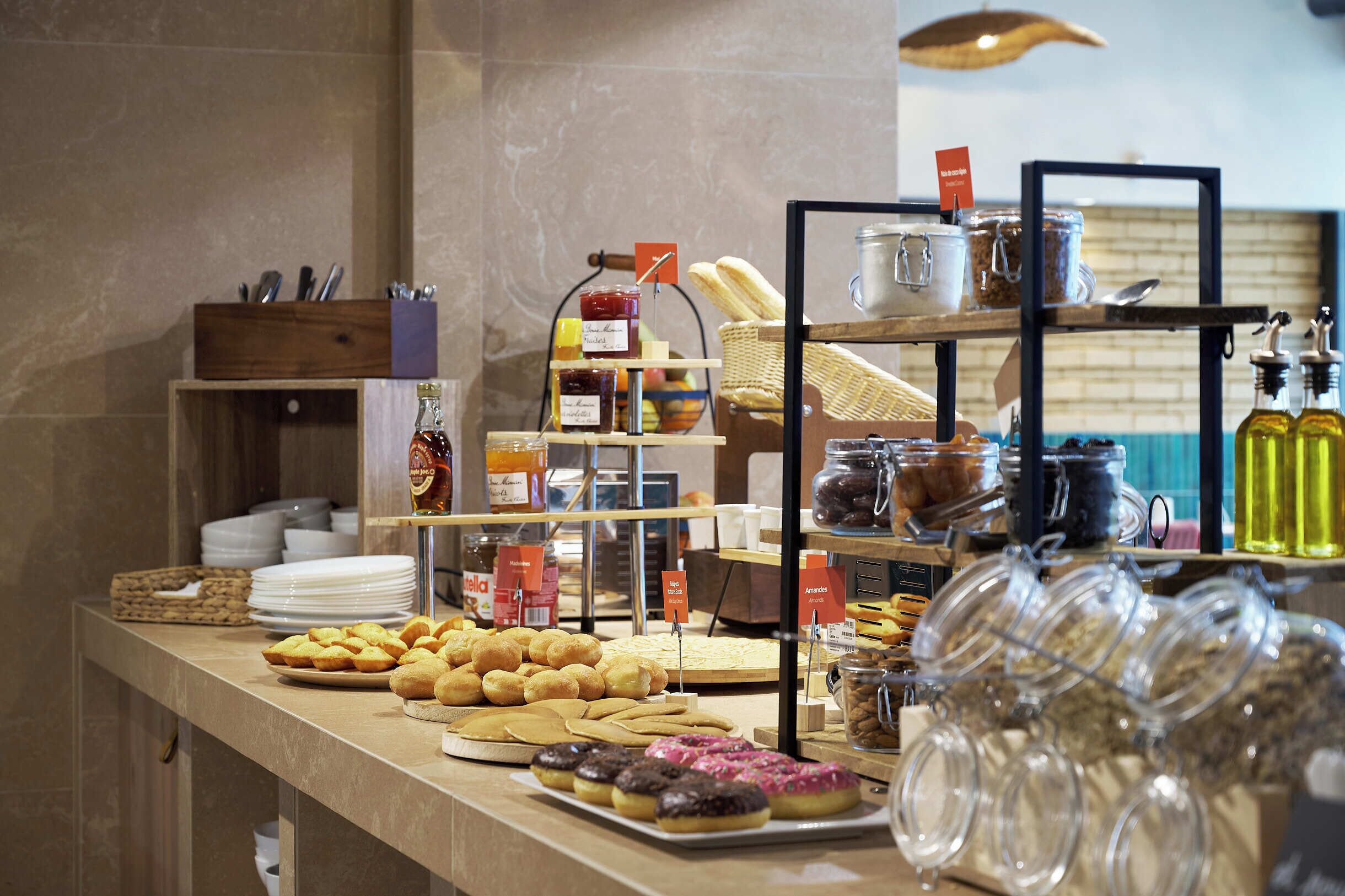 A buffet with various food items and condiments.