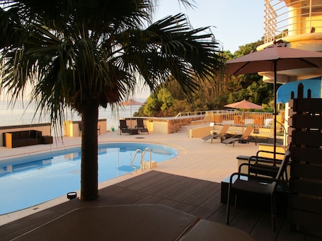 Outdoor pool, open 9:00 AM to 10:00 PM, sun loungers