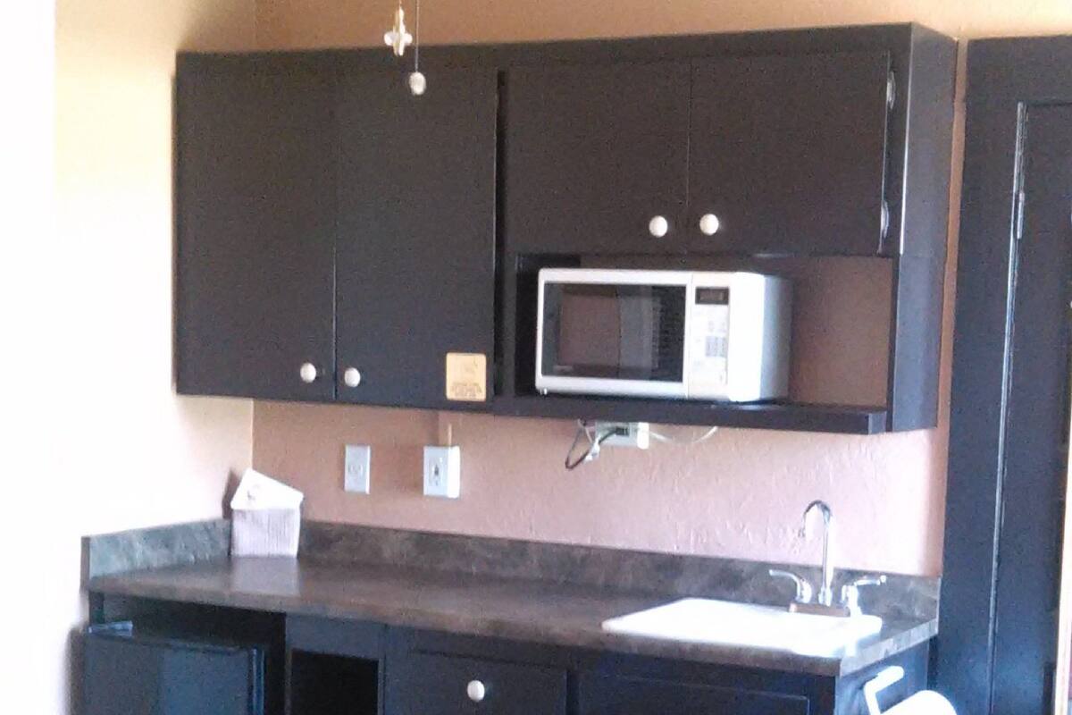 classic studio suite, 1 queen bed | private kitchenette | fridge, microwave, coffee/tea maker