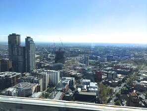 A cityscape with various buildings, including high-rise structures and smaller commercial buildings. - StayCentral - Melbourne Central (Melbourne)