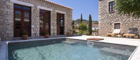 Outdoor pool, open 9:00 AM to 8:00 PM, pool loungers