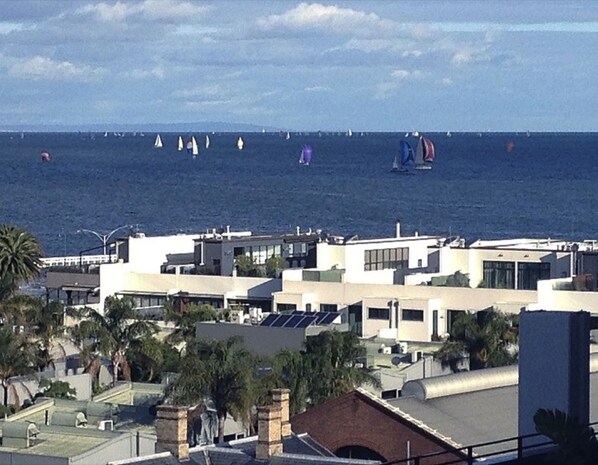 A coastal area with buildings and a view of the sea. - StayCentral - Spacious Seaviews (Port Melbourne)