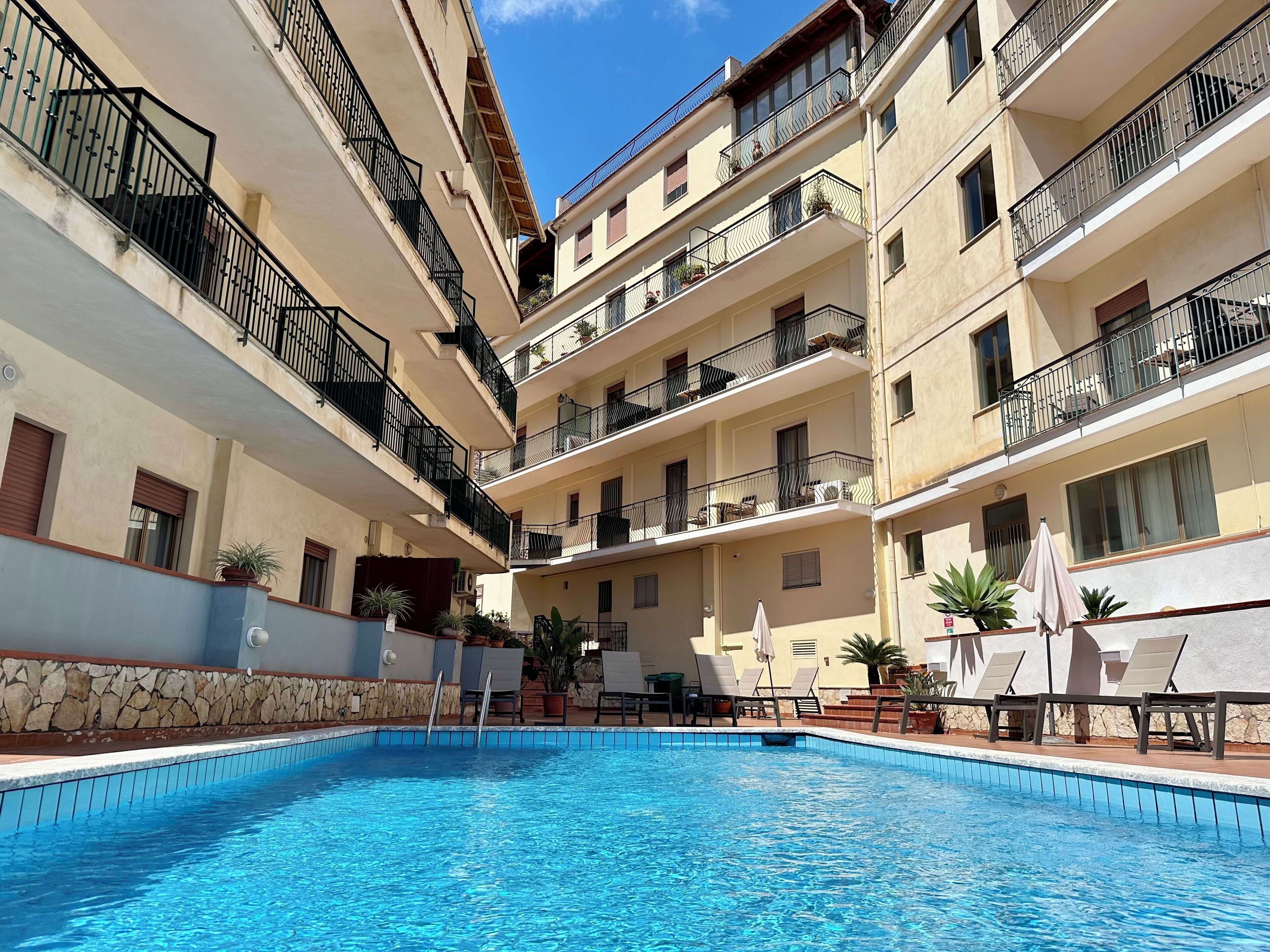 Outdoor pool, open 9:00 AM to 7:00 PM, pool umbrellas, sun loungers