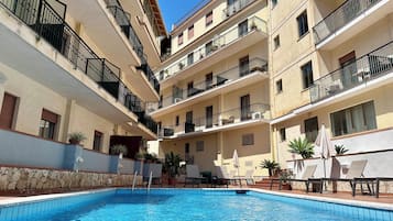 Outdoor pool, open 9:00 AM to 7:00 PM, pool umbrellas, sun loungers