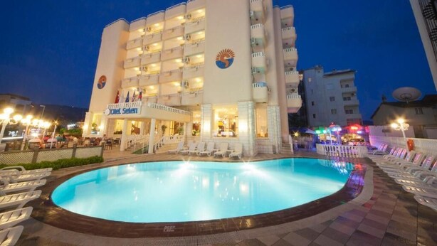 A hotel with a swimming pool, multiple balconies, and a sign reading "Hotel Selen." - Hotel Selen (Marmaris)