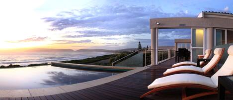 Outdoor pool, pool umbrellas, sun loungers