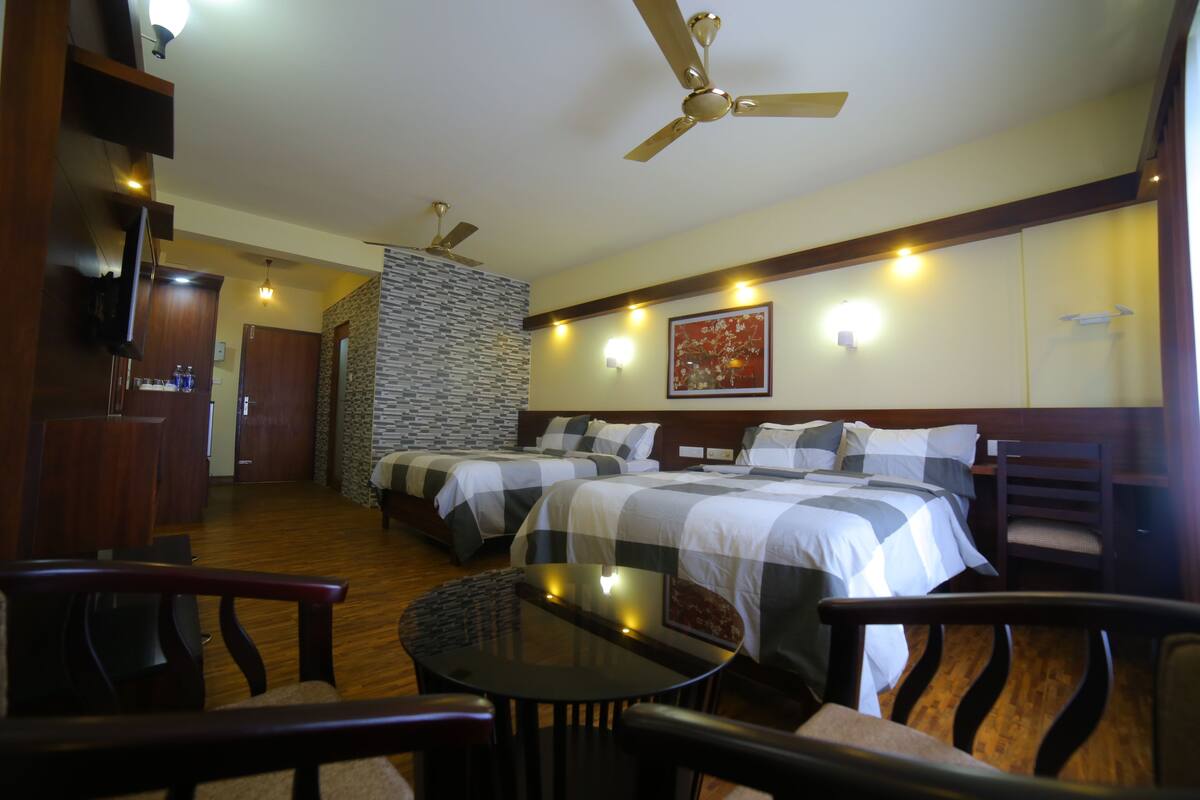 Deluxe Quadruple Room, 2 Queen Beds, Non Smoking, City View | Desk, rollaway beds, free WiFi, bed sheets