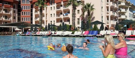 Outdoor pool, open 8 AM to 7 PM, pool umbrellas, sun loungers