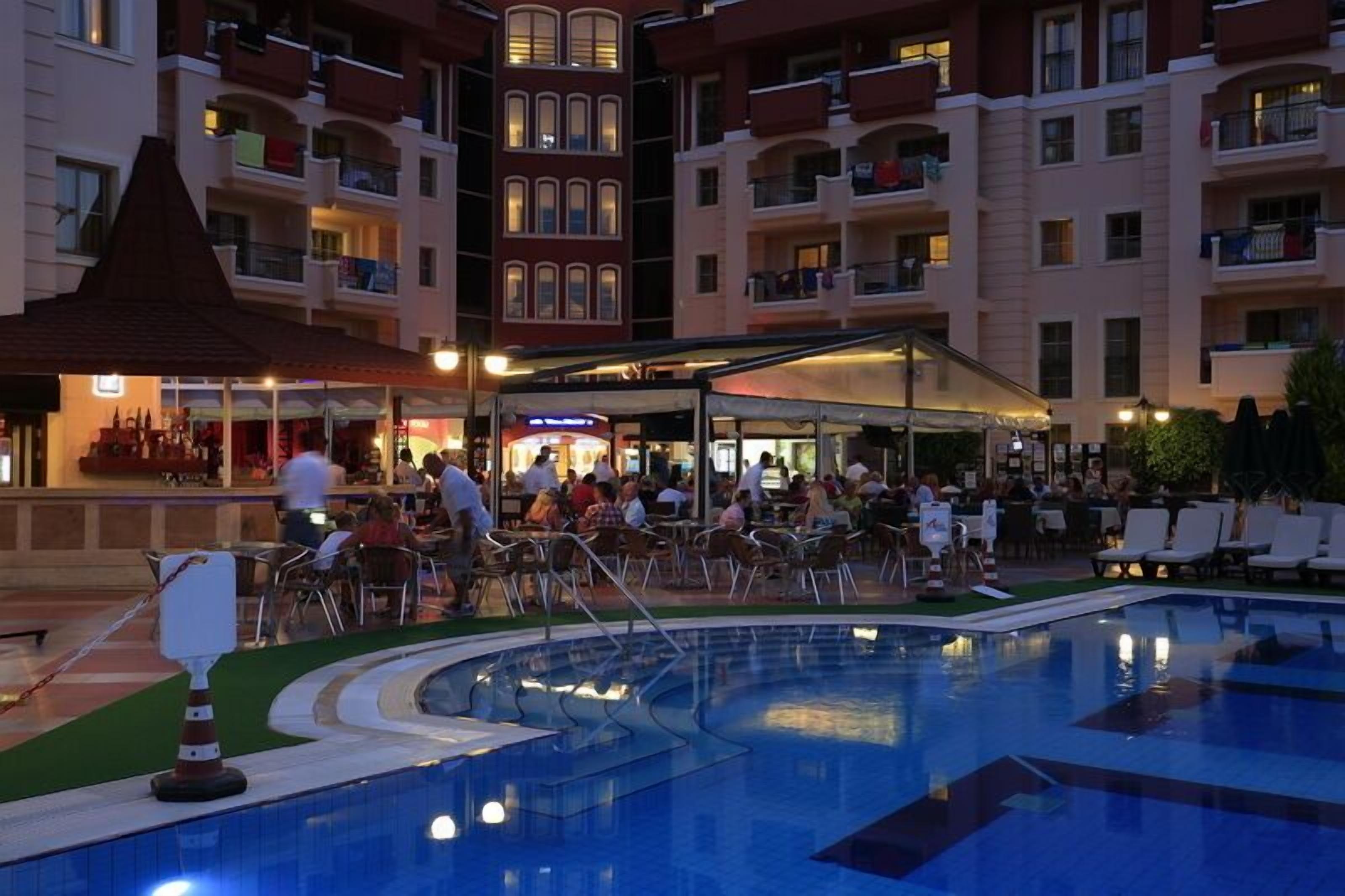 outdoor pool, open 8 am to 7 pm, pool umbrellas, pool loungers