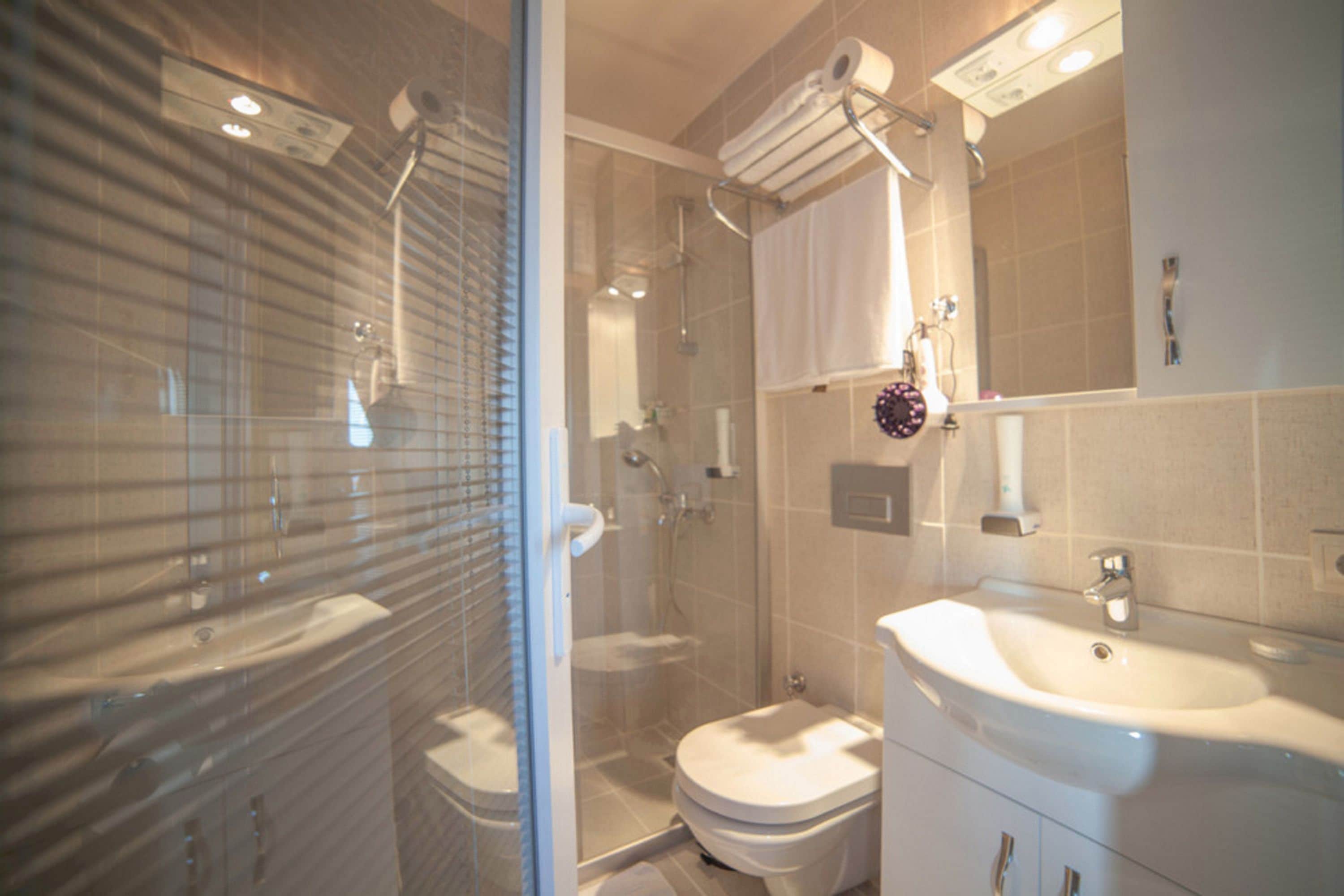 room, sea view | bathroom | shower, hair dryer, slippers, towels