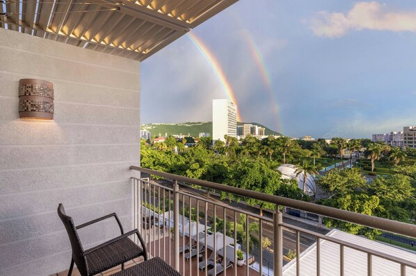 A balcony with a view of a cityscape and a rainbow. - Courtyard by Marriott Kingston, Jamaica (Kingston)