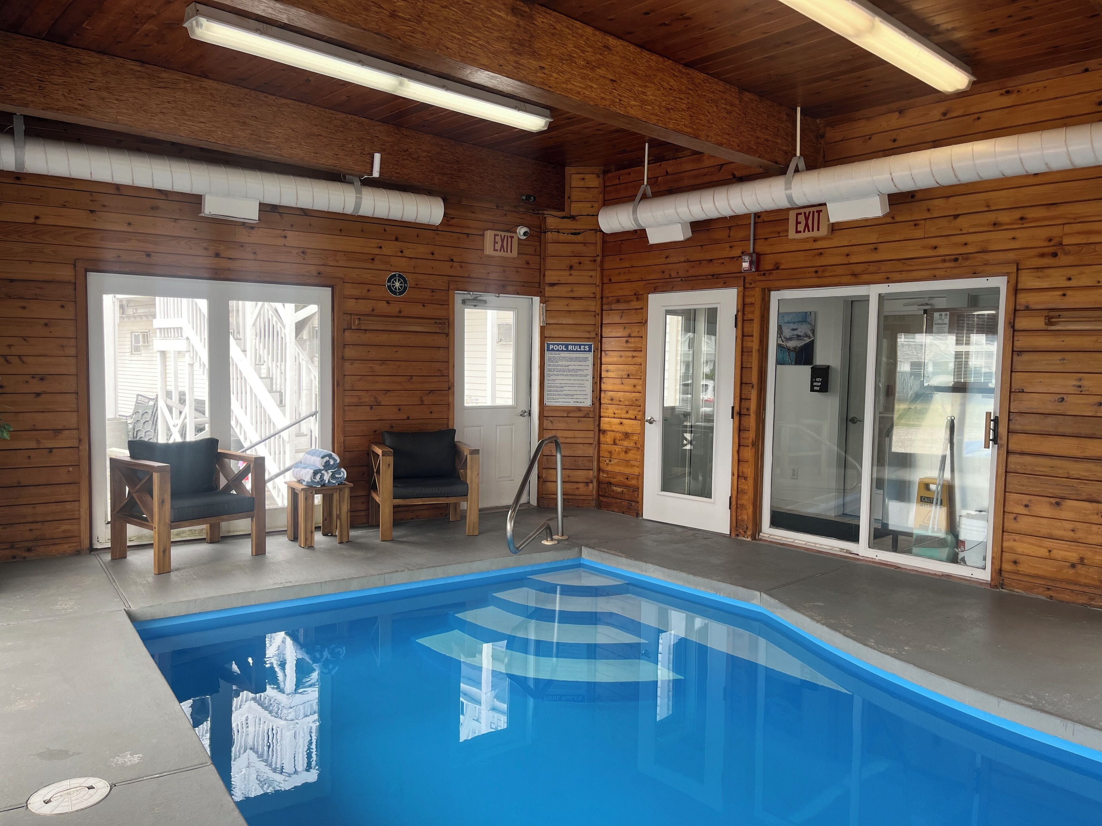 indoor pool, open 10:00 am to 9:00 pm, pool loungers