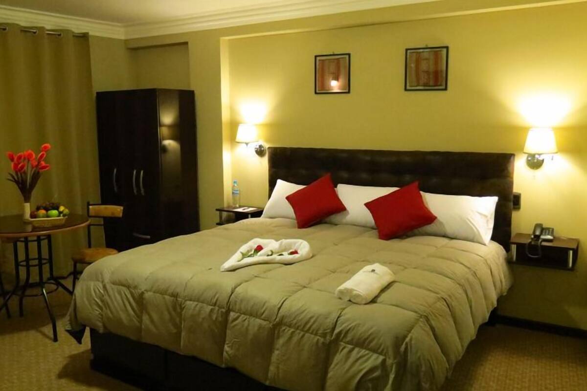 Junior Suite, Jetted Tub | In-room safe, blackout drapes, WiFi (free), bed sheets