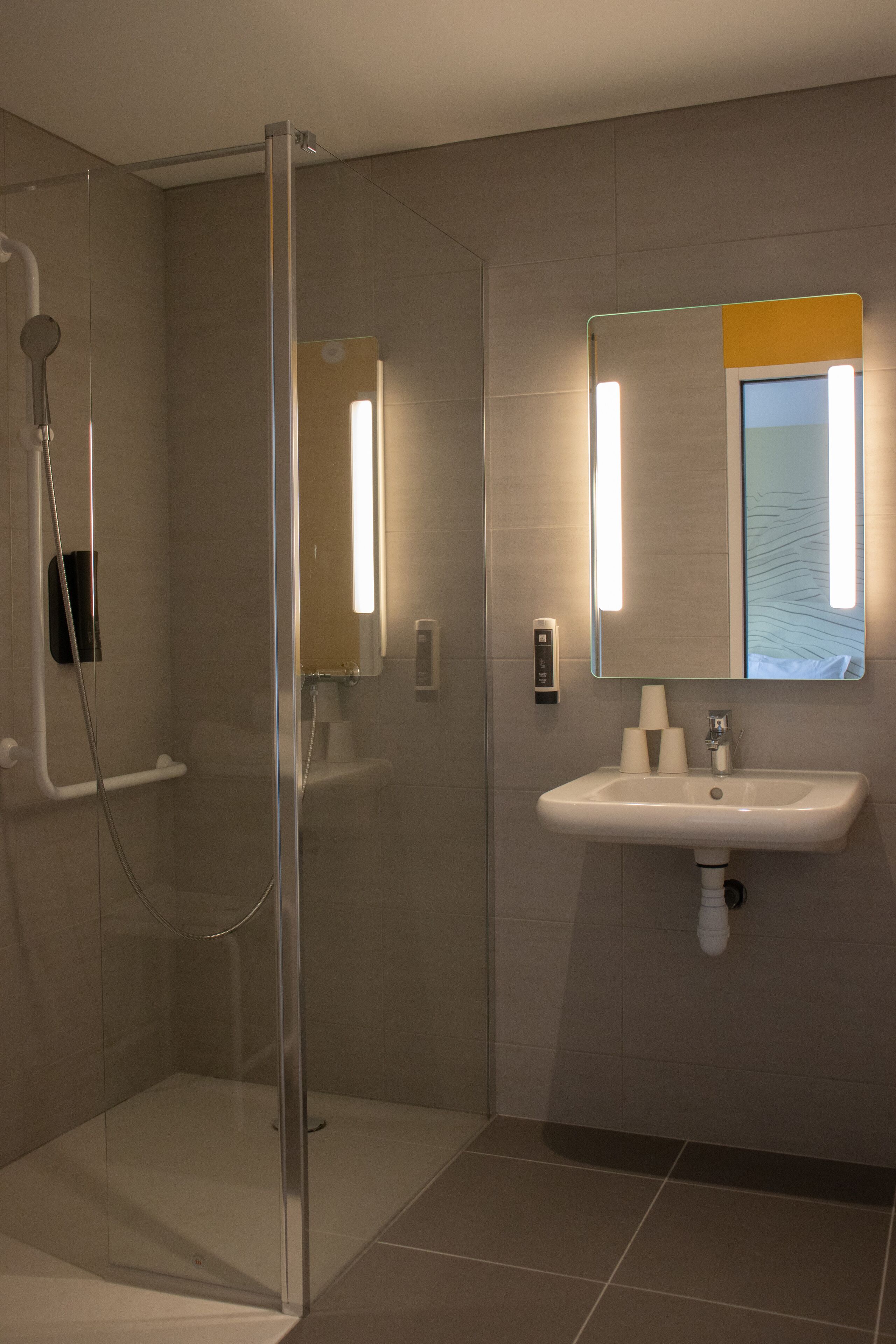 standard triple room, multiple beds, mobility accessible, non smoking | bathroom | shower, towels