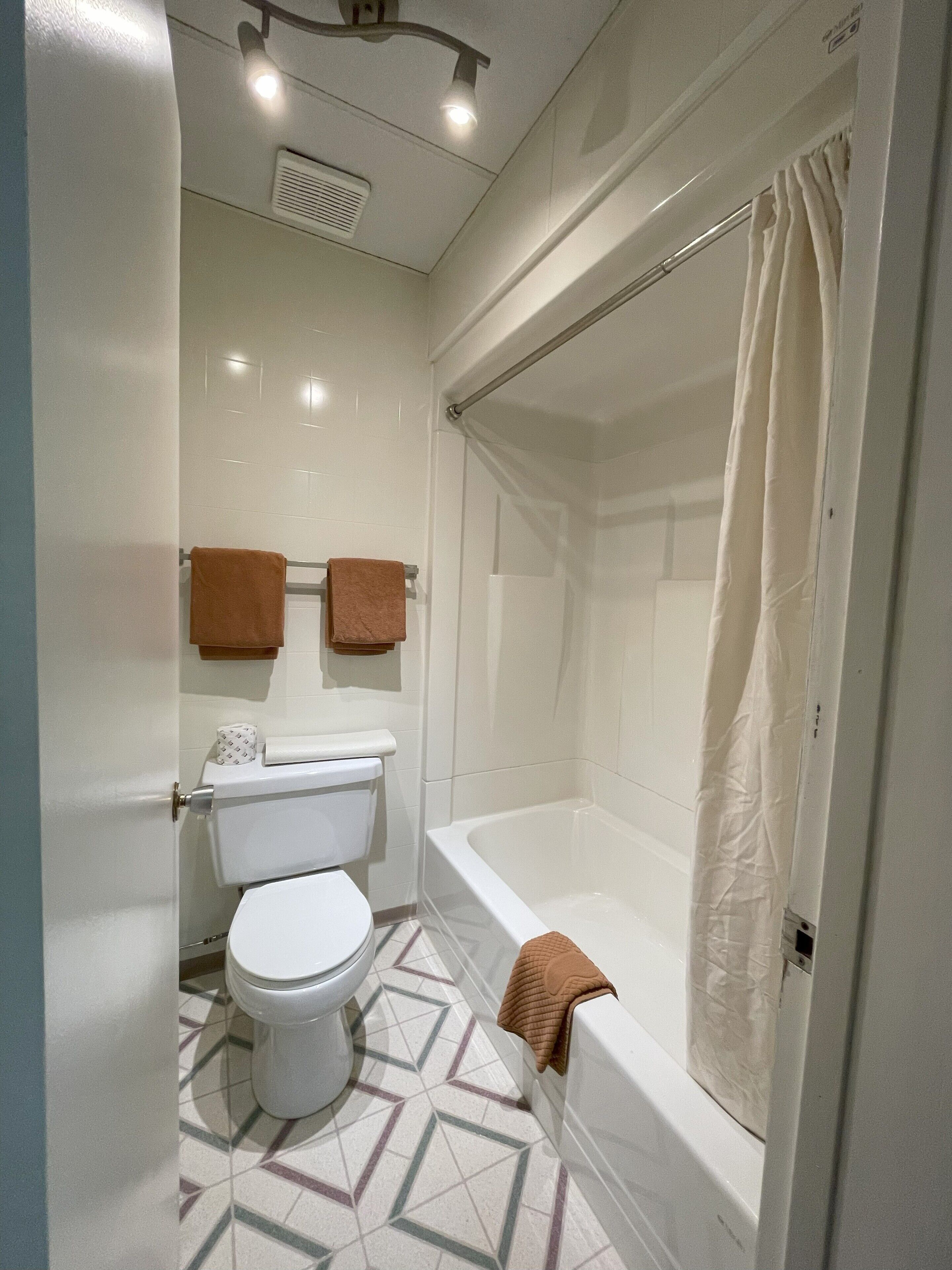 double room, 2 queen beds | bathroom | combined shower/bathtub, towels
