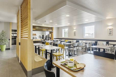 Daily buffet breakfast for a fee. B&B HOTEL Lyon Grand Stade Meyzieu