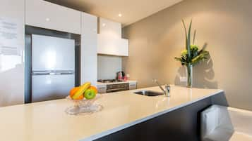 Two Bedroom Apartment | Private kitchen | Full-sized fridge, microwave, stovetop, dishwasher