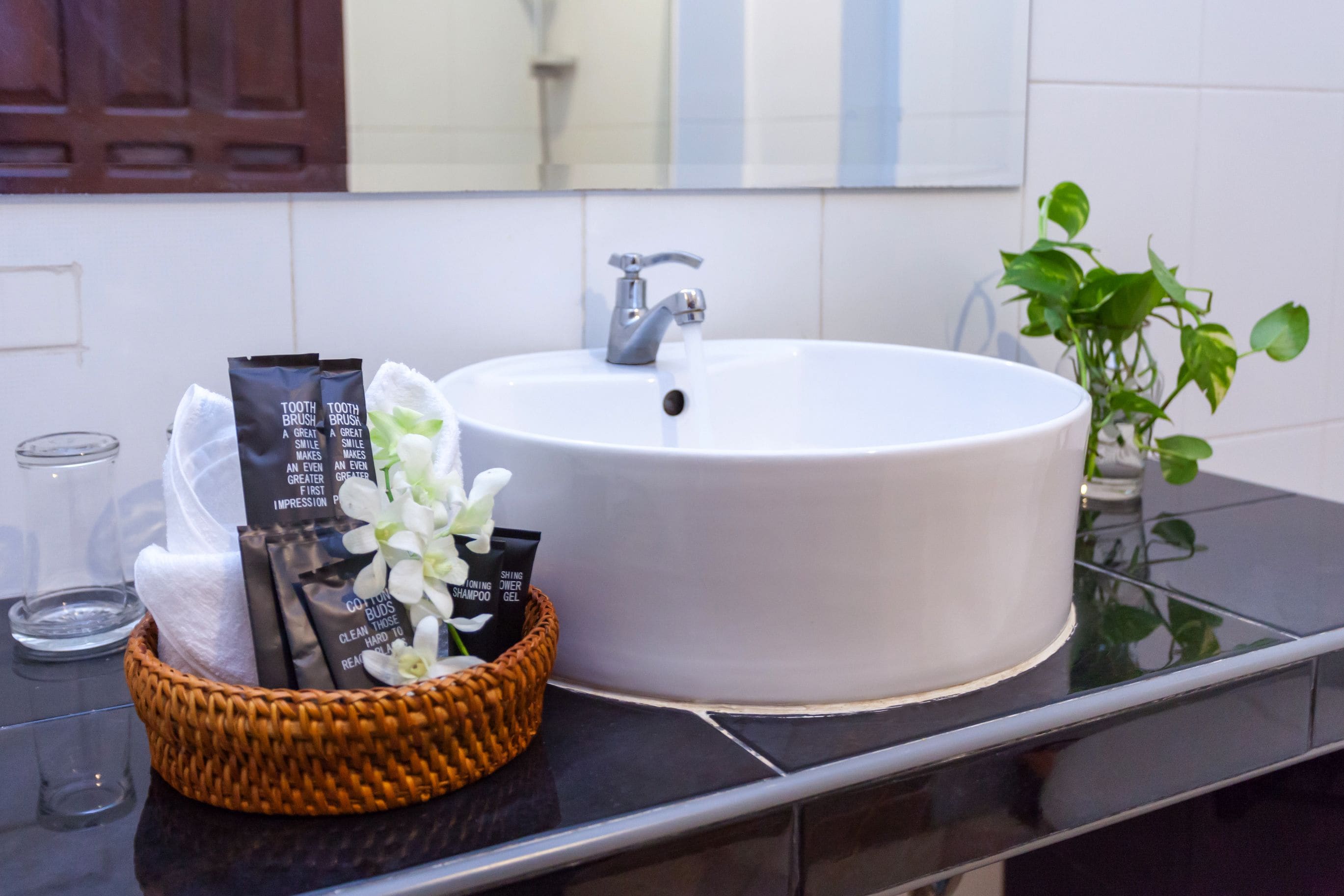 shower, hair dryer, slippers, towels