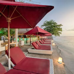 On the beach, white sand, sun-loungers, beach umbrellas