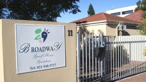 A sign for "Broadway Guest House" with a contact number. - Broadway Guesthouse (Cape Town)