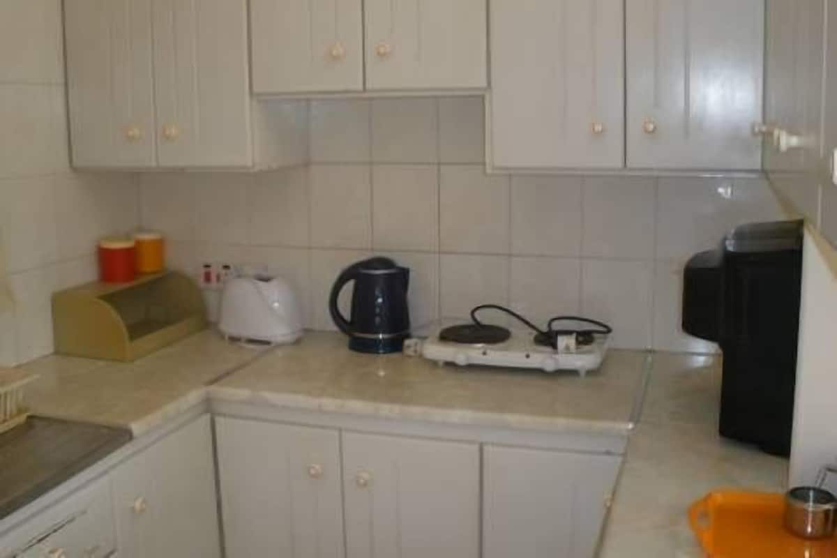 Fridge, coffee/tea maker, cookware/dishes/utensils
