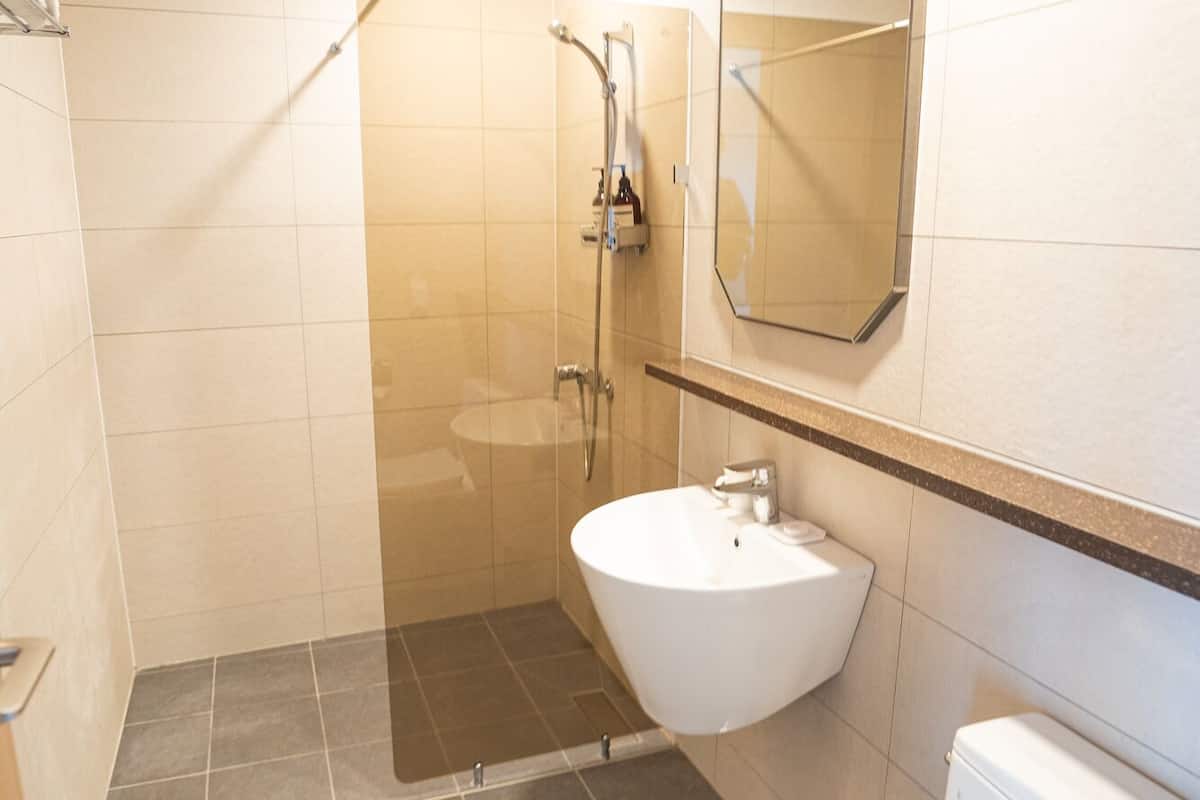 family suite, ocean view (clean type) | bathroom | shower, hair dryer, towels, soap