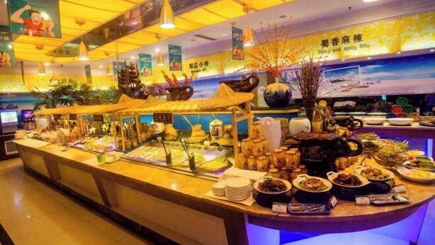 A buffet area with various dishes and food items displayed on a counter. - Blue Horizon Hotel (Fuqian Street Dongcheng Dongying) (Dongying)