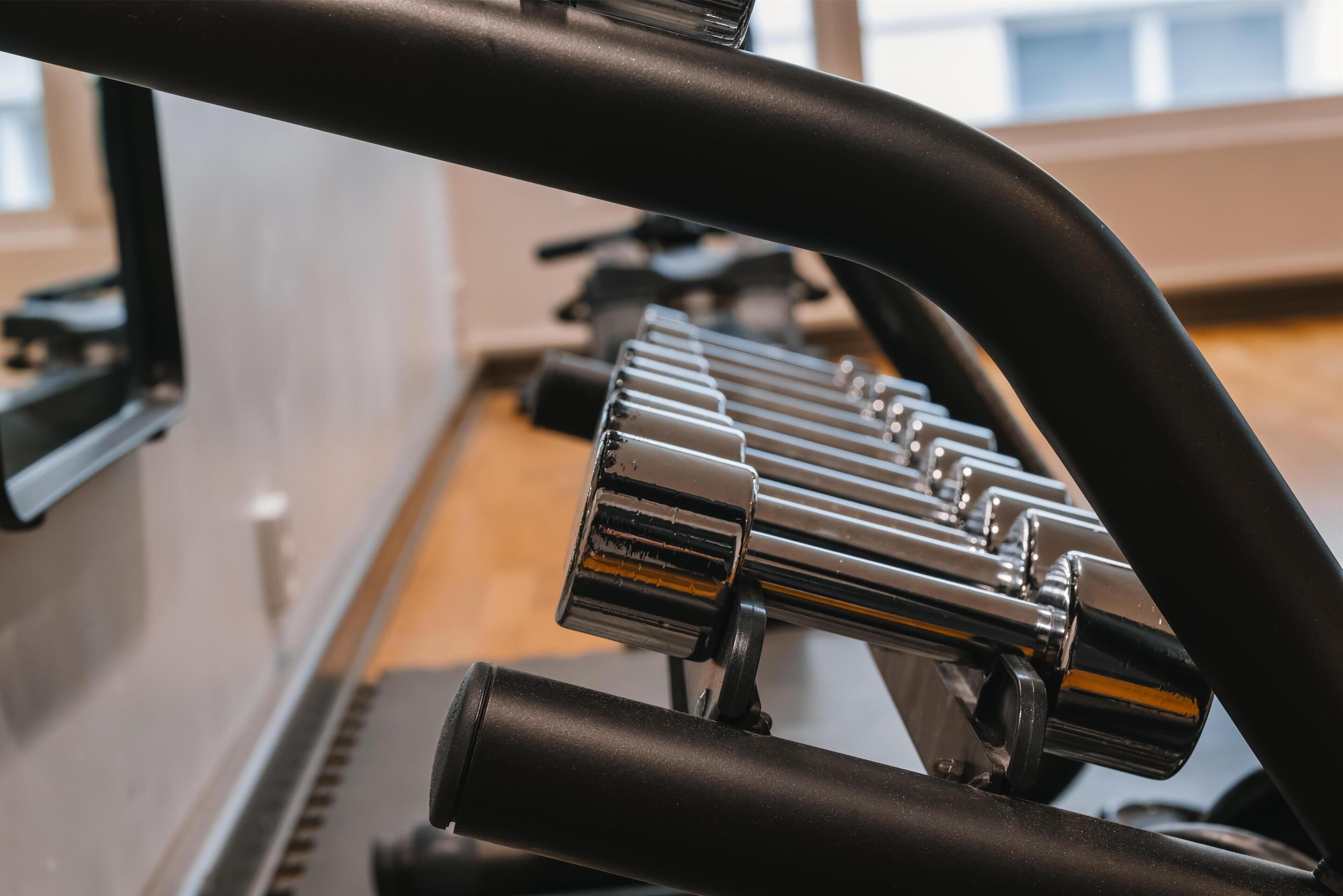 A close-up of a stationary bike with a sleek design and metallic components.
