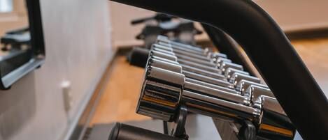 A close-up of a stationary bike with a sleek design and metallic components.