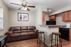 Suite, 1 Bedroom, Non Smoking | 1 bedroom, desk, laptop workspace, iron/ironing board - Eagle's Den Suites Big Spring a Travelodge by Wyndham (Big Spring)