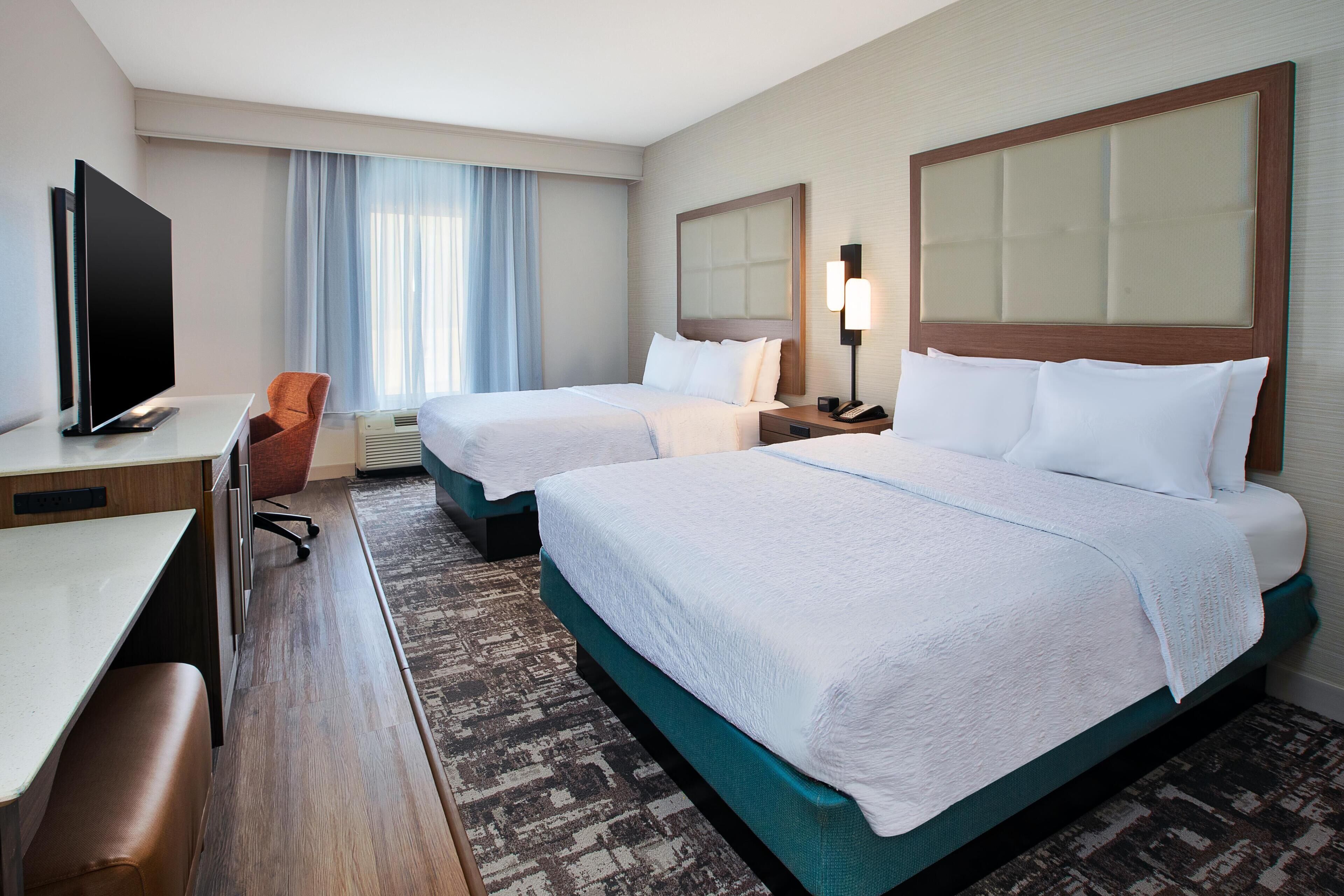 Room, 2 Queen Beds, Refrigerator | In-room safe, soundproofing, iron/ironing board, cribs/infant beds