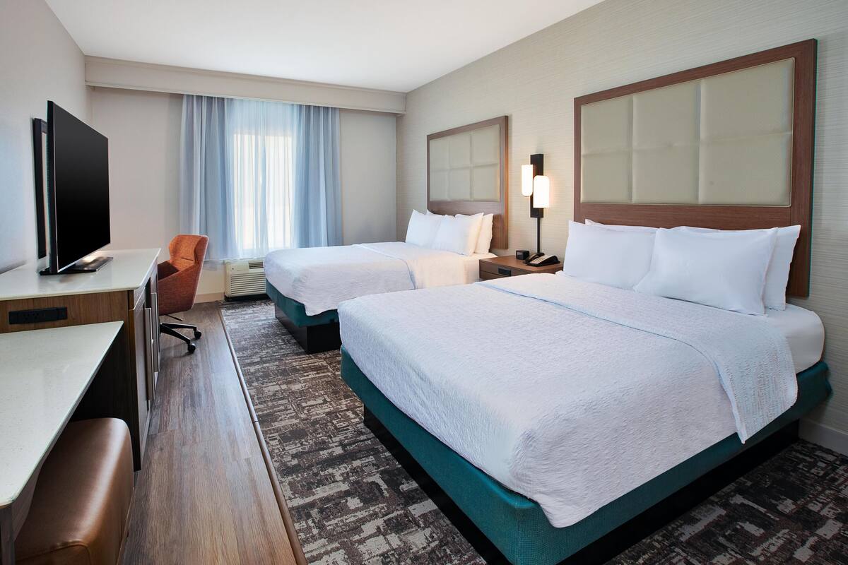 Room, 2 Queen Beds, Refrigerator | In-room safe, soundproofing, iron/ironing board, cribs/infant beds