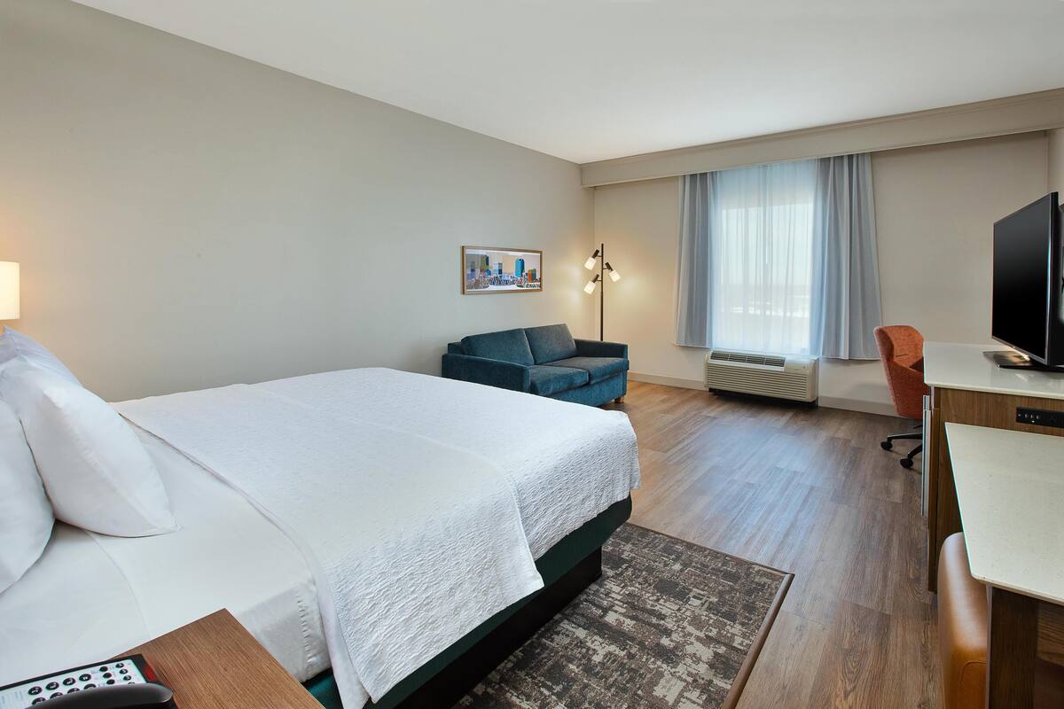 Room, 1 King Bed with Sofa bed, Refrigerator | Living area | 40-inch LCD TV with cable channels, TV