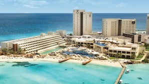 A resort with multiple buildings, a beach, and a pool area. - Hyatt Ziva Cancun All Inclusive (Cancun)
