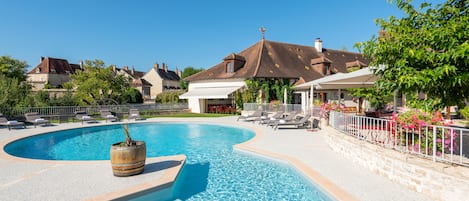 Seasonal outdoor pool, pool umbrellas, pool loungers