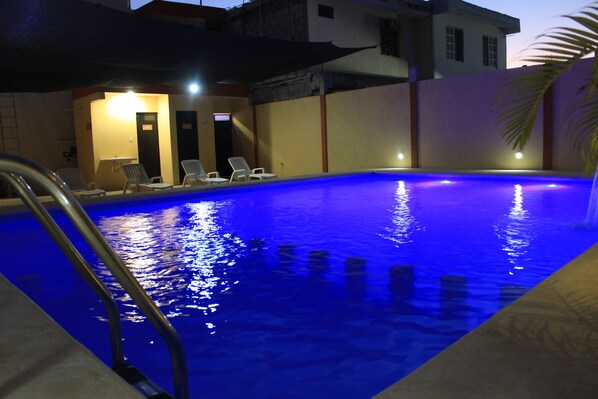 Outdoor pool, open 8:30 AM to 6:00 PM, pool loungers