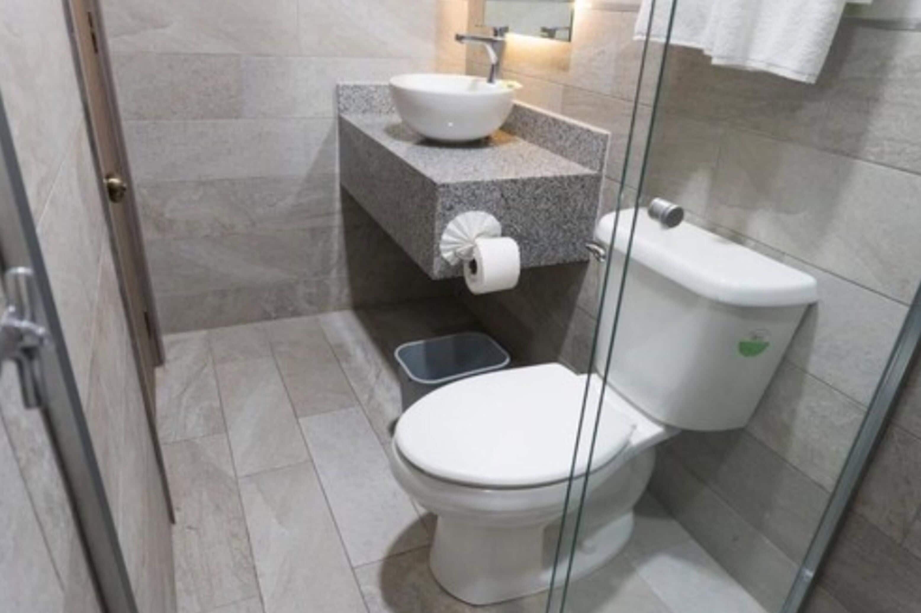 standard double room, 2 double beds | bathroom | shower, free toiletries, hair dryer, towels