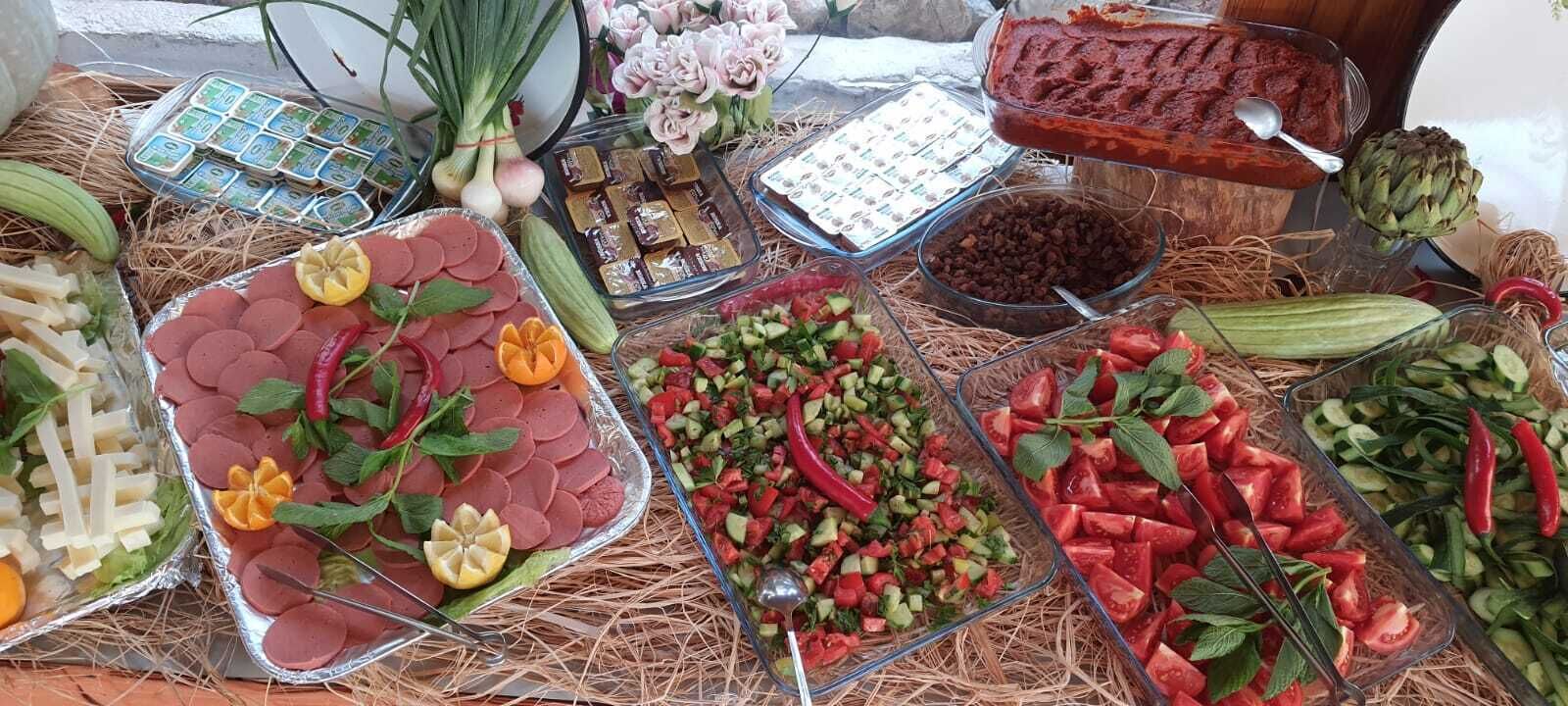 A variety of food items and condiments arranged on a table.