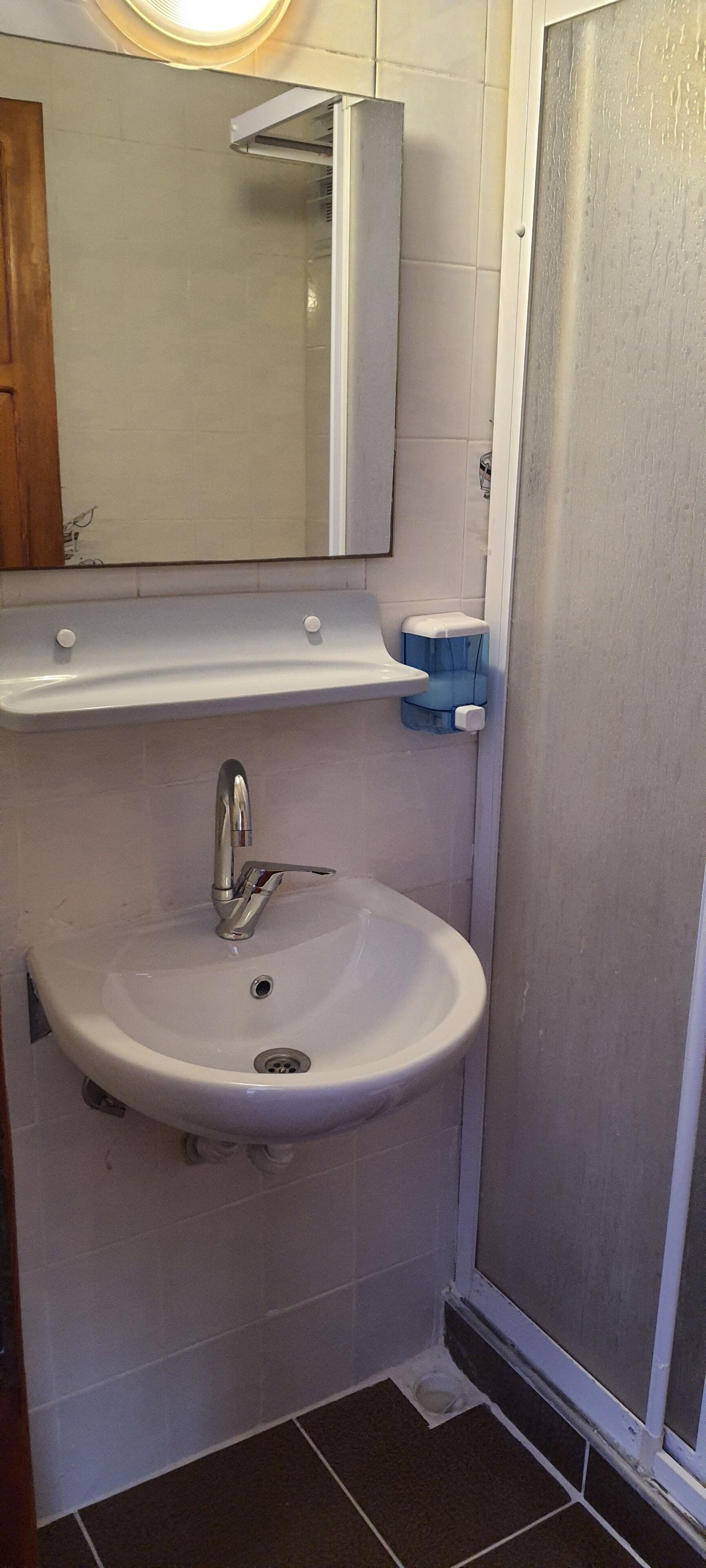 shower, free toiletries, hair dryer, slippers