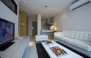 Suite, 2 Bedrooms | Living area | 32-inch LCD TV with cable channels, TV