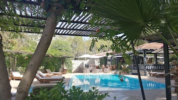Seasonal outdoor pool, pool umbrellas, pool loungers