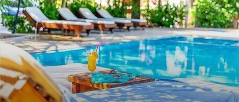 Seasonal outdoor pool, pool umbrellas, sun loungers