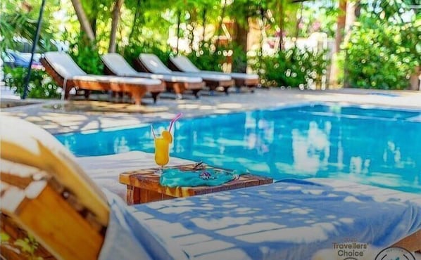 Seasonal outdoor pool, pool umbrellas, pool loungers