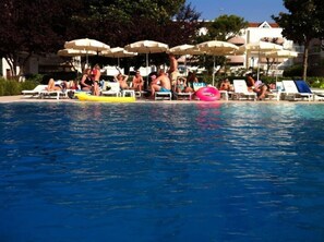 Seasonal outdoor pool, pool umbrellas, pool loungers
