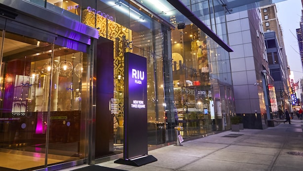 A modern building with large glass windows and a prominent RII sign.