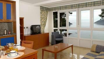 Apartment, 1 Bedroom | Living room | TV