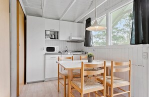 Economy Cabin, 2 Bedrooms, Shared Bathroom (Linen Excluded) | Private kitchen | Fridge, coffee/tea maker, highchair - First Camp Ajstrup Strand (Malling)